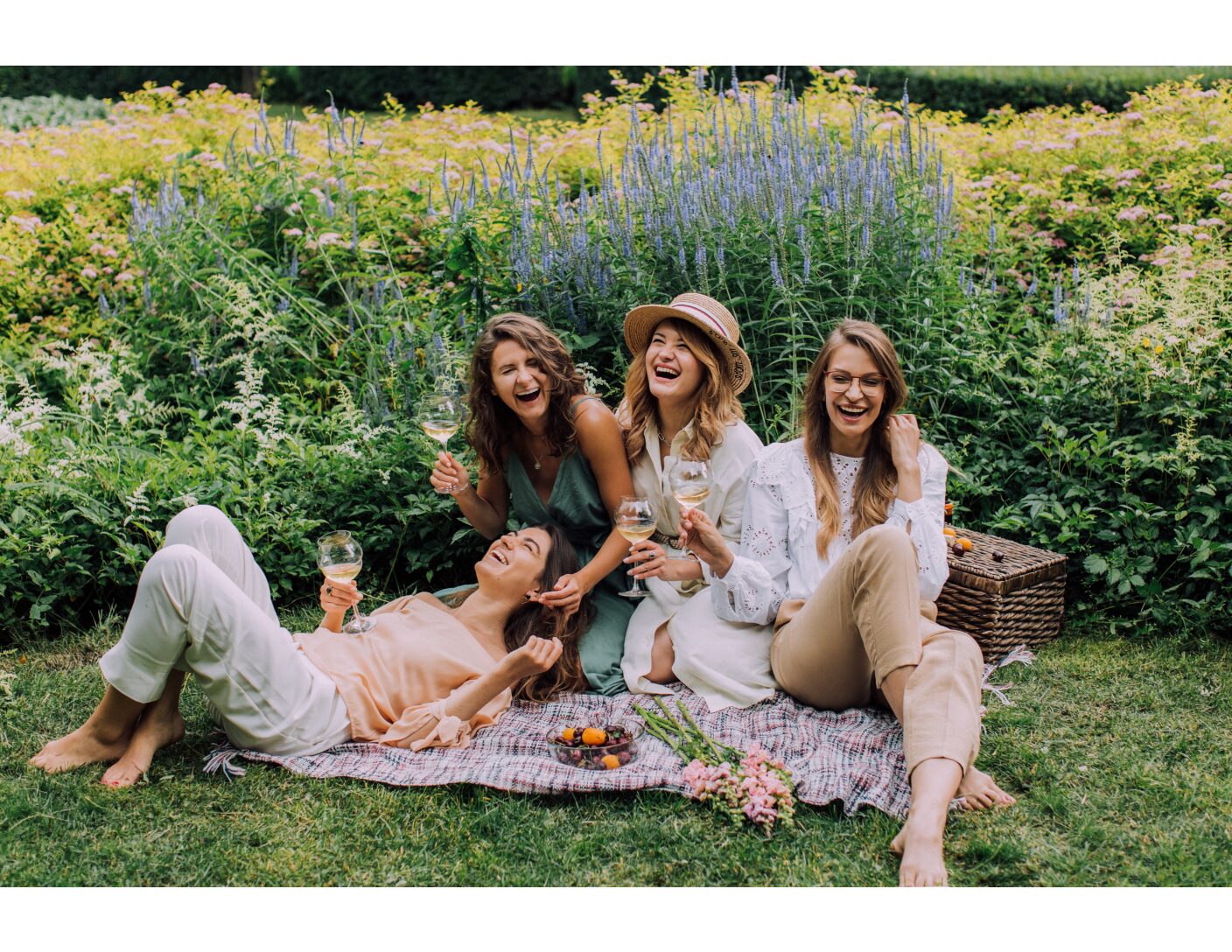 women having wine at a picnic